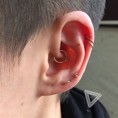 guys with cartilage piercing|men with multiple ear piercings.